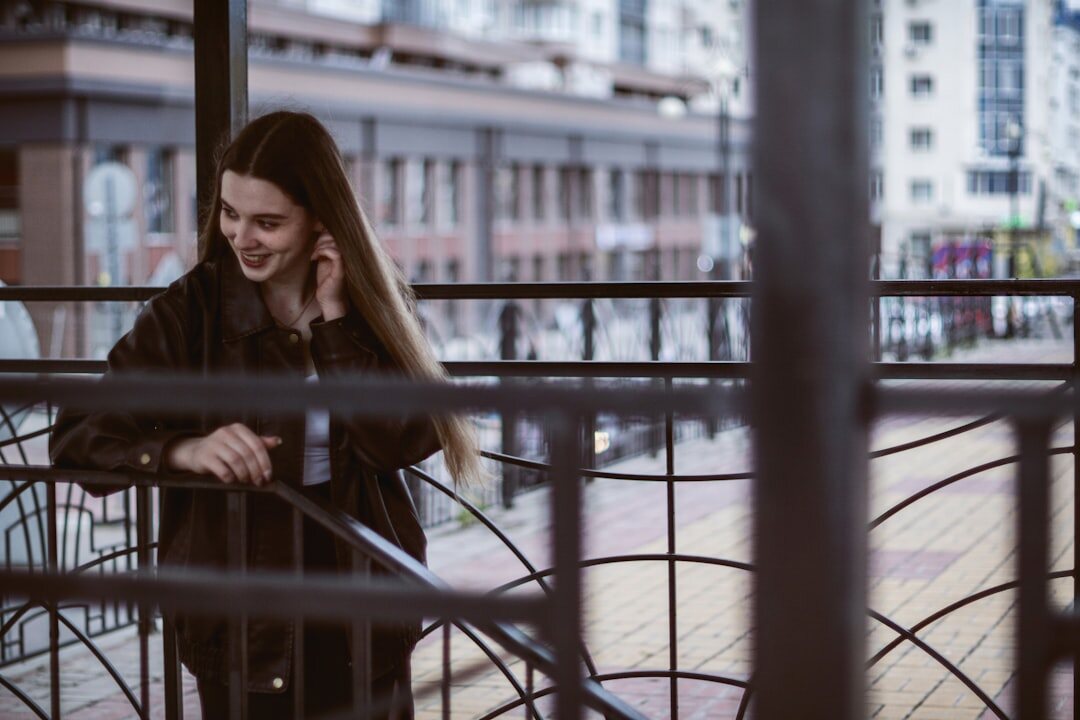 Young woman using her mobile phone outdoors on a city street